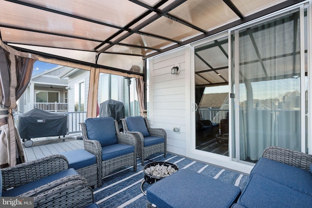 view of patio with a grill, a pergola, and an outdoor living space