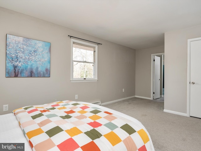 unfurnished bedroom with carpet floors, baseboard heating, and baseboards