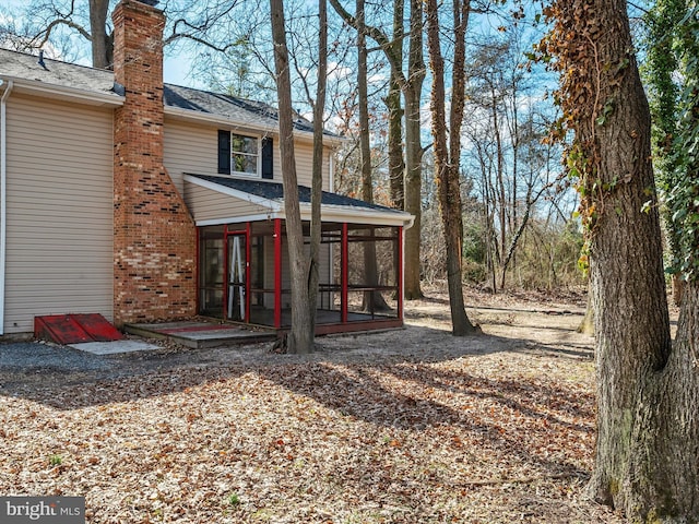 view of yard with a sunroom