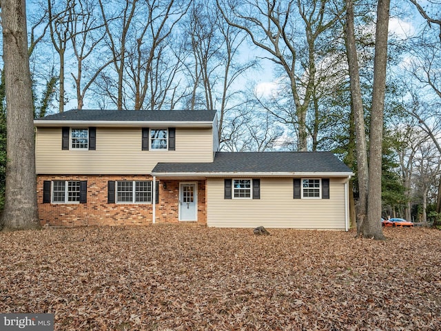 view of front of home featuring brick siding