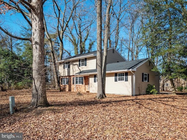 exterior space with brick siding