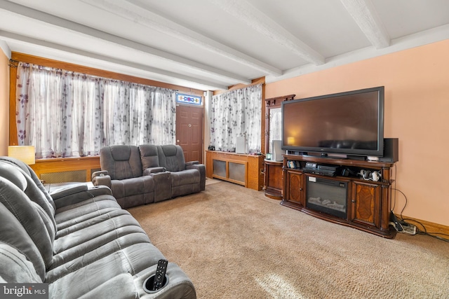 living room with light carpet and beam ceiling