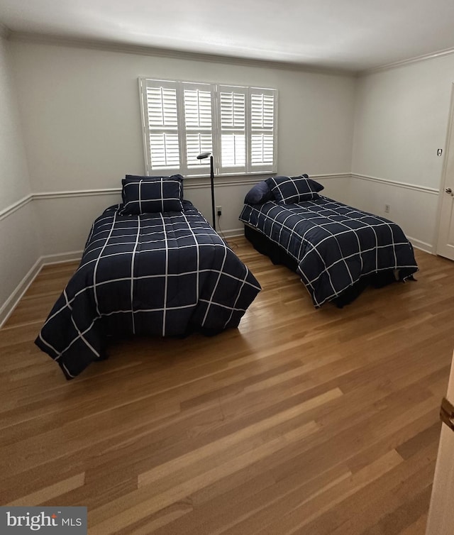 bedroom featuring wood-type flooring