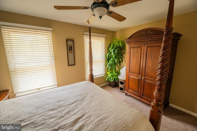 bedroom featuring light carpet and ceiling fan