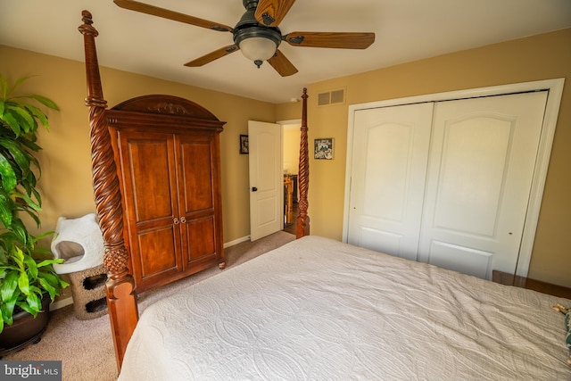 bedroom featuring ceiling fan, light colored carpet, and a closet