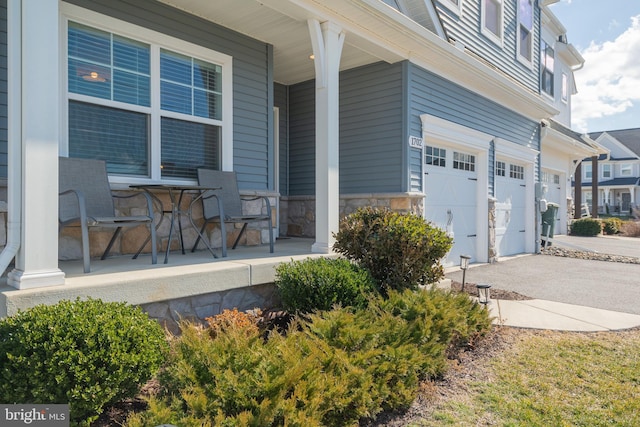 exterior space featuring a garage and a porch