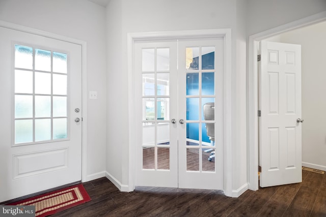 doorway with dark hardwood / wood-style flooring and french doors