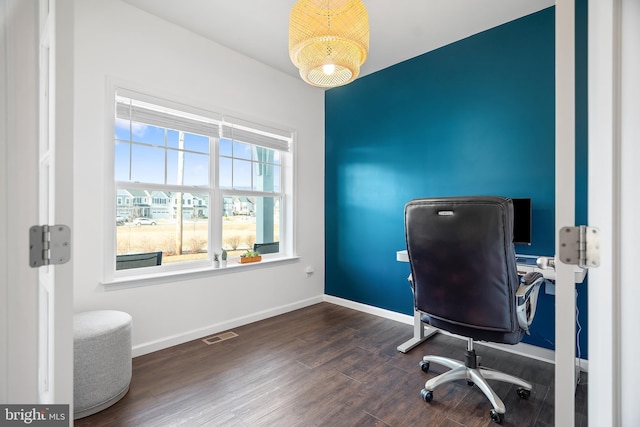 office with dark hardwood / wood-style flooring