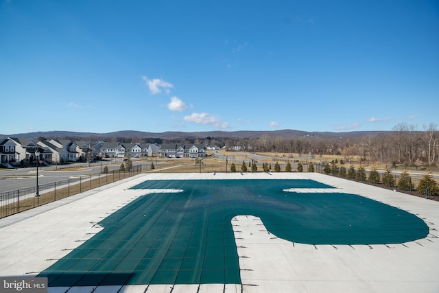 view of swimming pool featuring a mountain view