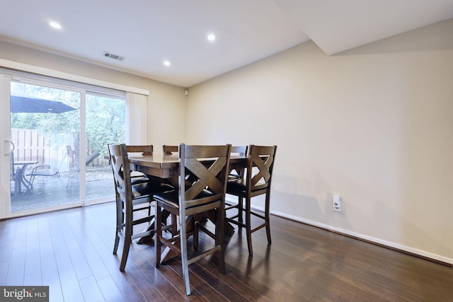 dining area featuring dark wood-type flooring