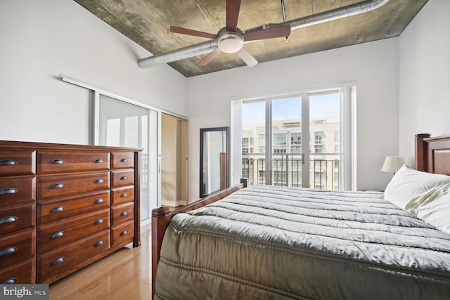 bedroom with ceiling fan, a closet, and light wood-type flooring