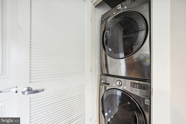 laundry area with stacked washing maching and dryer