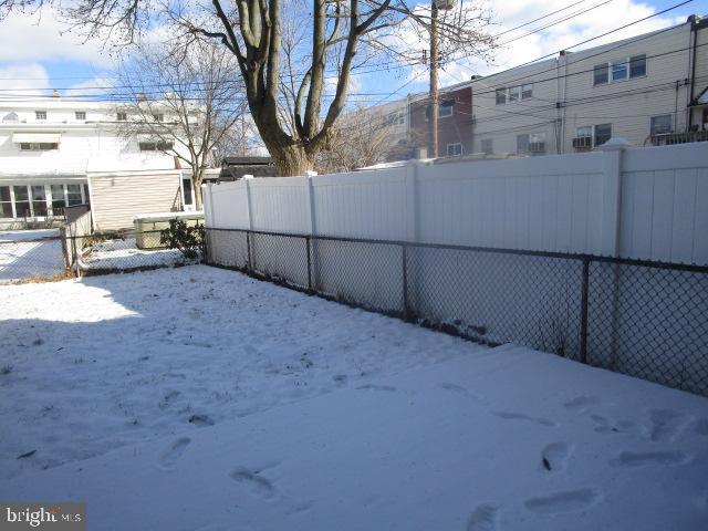 view of yard covered in snow