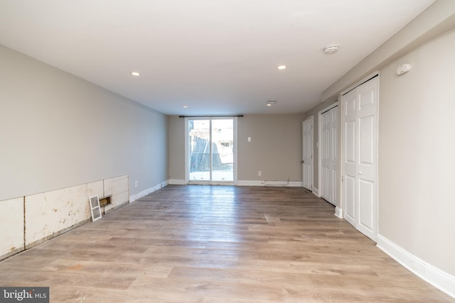 spare room with light hardwood / wood-style floors