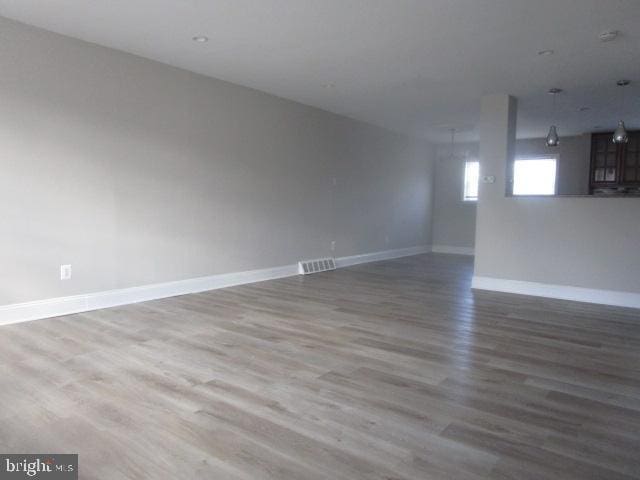 spare room with hardwood / wood-style flooring