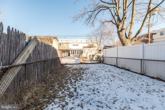 view of yard layered in snow