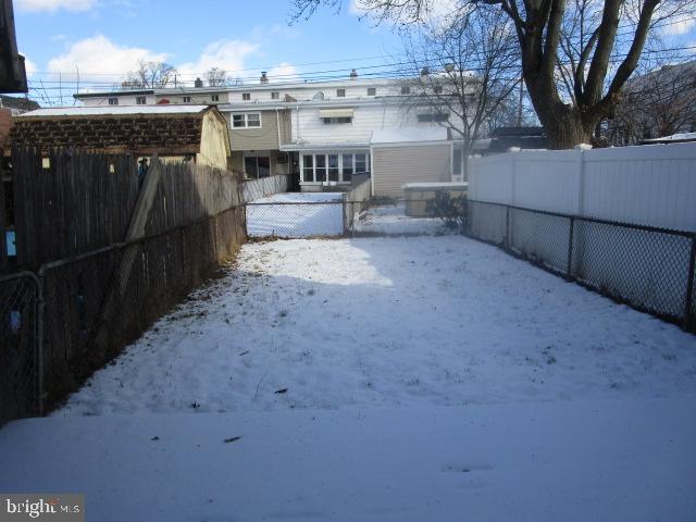 view of yard layered in snow