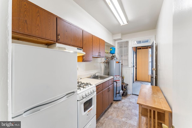 kitchen featuring sink, white appliances, and water heater