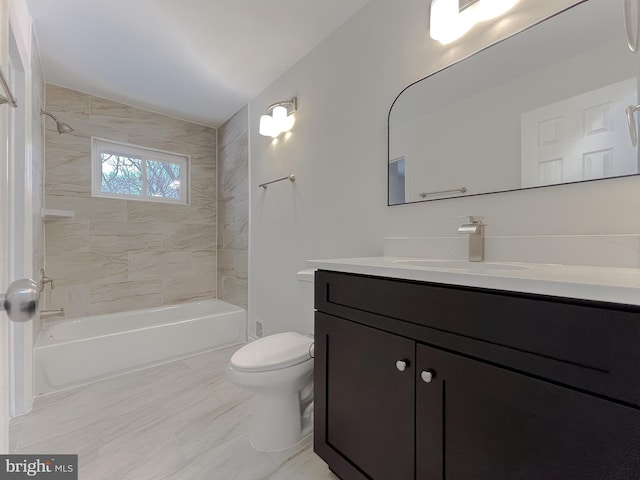 full bathroom with tiled shower / bath combo, toilet, and vanity