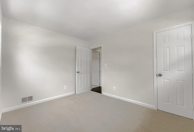 empty room with carpet flooring