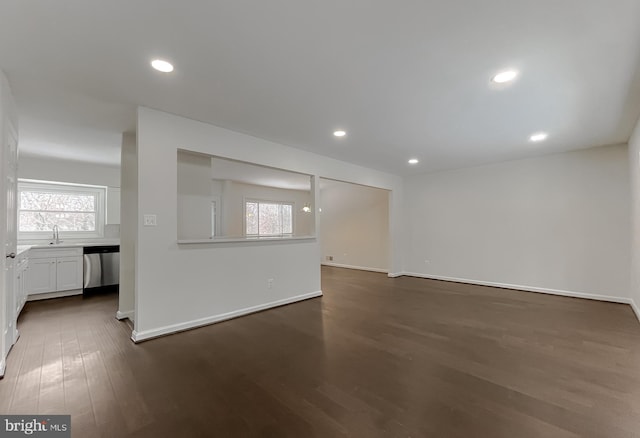 empty room with sink and dark wood-type flooring