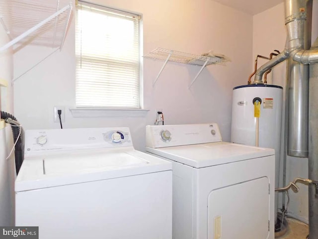 clothes washing area with independent washer and dryer and water heater