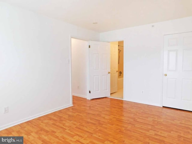 unfurnished room featuring light hardwood / wood-style flooring