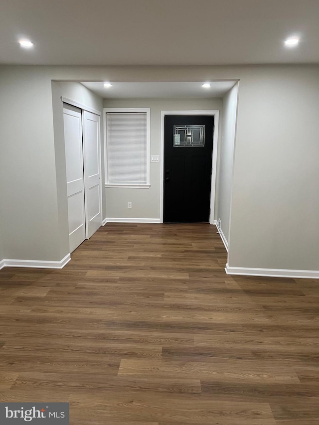 foyer with dark hardwood / wood-style floors