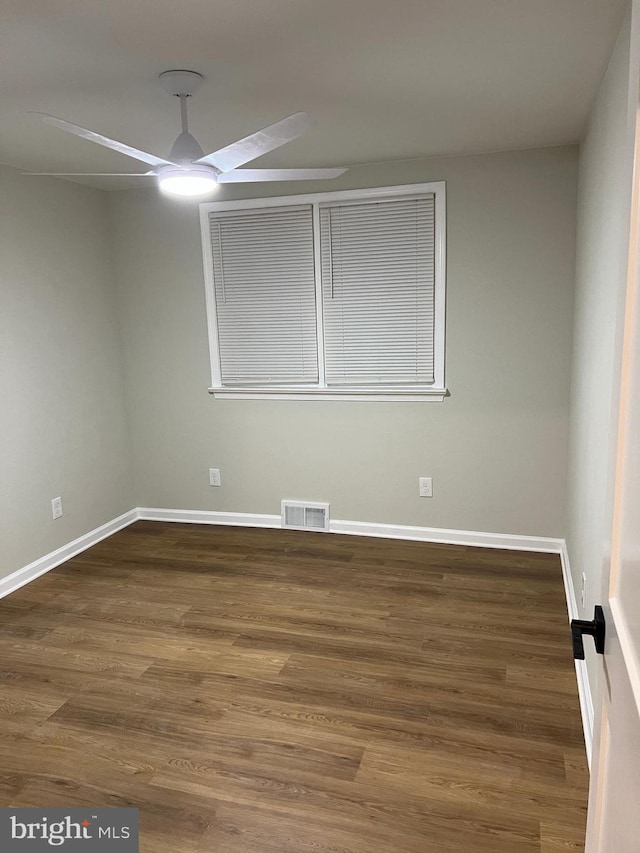 empty room featuring ceiling fan and wood-type flooring