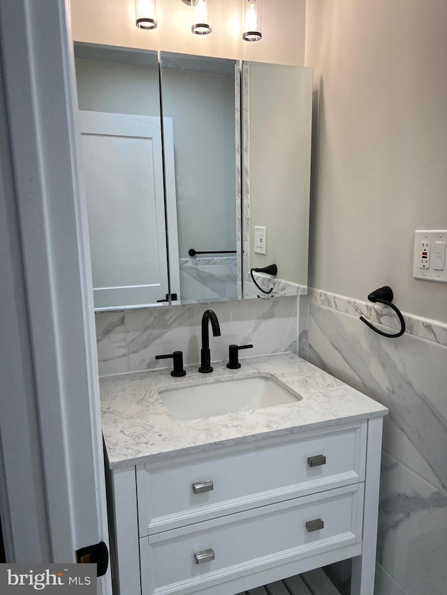 bathroom with backsplash and vanity