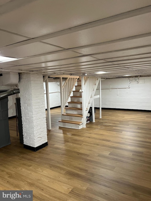 basement featuring hardwood / wood-style flooring