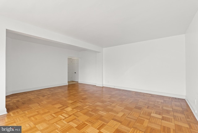 spare room featuring light parquet flooring