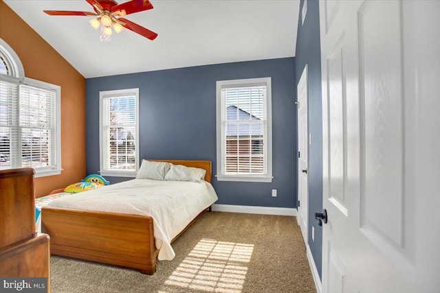 bedroom featuring vaulted ceiling, light carpet, and ceiling fan