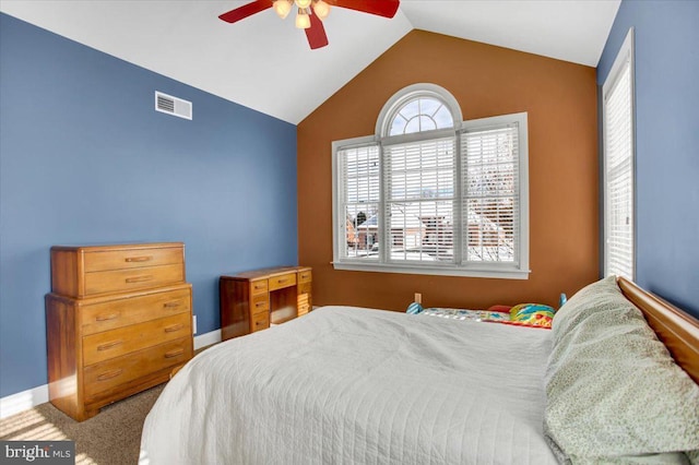 bedroom with vaulted ceiling, carpet floors, and ceiling fan