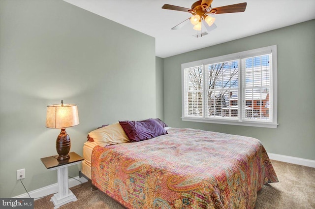 bedroom with ceiling fan and carpet