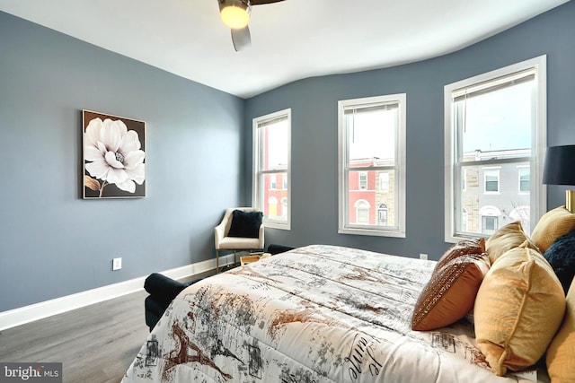 bedroom featuring ceiling fan and dark hardwood / wood-style flooring