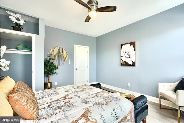 bedroom featuring hardwood / wood-style floors and ceiling fan