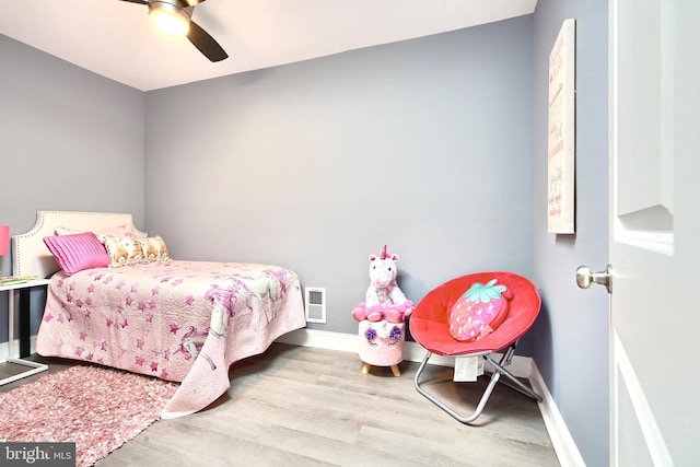 bedroom featuring ceiling fan and light hardwood / wood-style floors