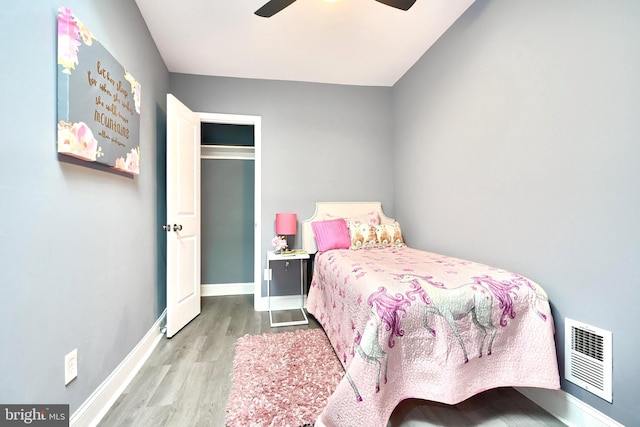 bedroom featuring light hardwood / wood-style flooring and ceiling fan