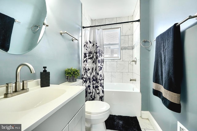 full bathroom featuring vanity, toilet, and shower / tub combo with curtain