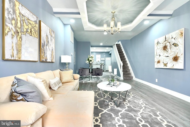 living room featuring an inviting chandelier and hardwood / wood-style flooring