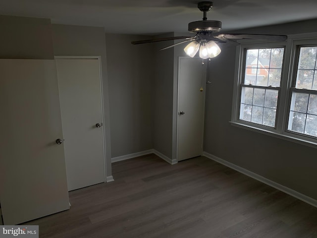 unfurnished bedroom featuring a closet, ceiling fan, and wood-type flooring