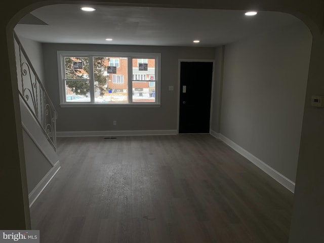 spare room featuring dark hardwood / wood-style flooring