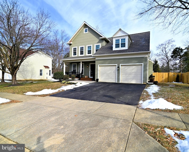 view of front of home with a garage and covered porch