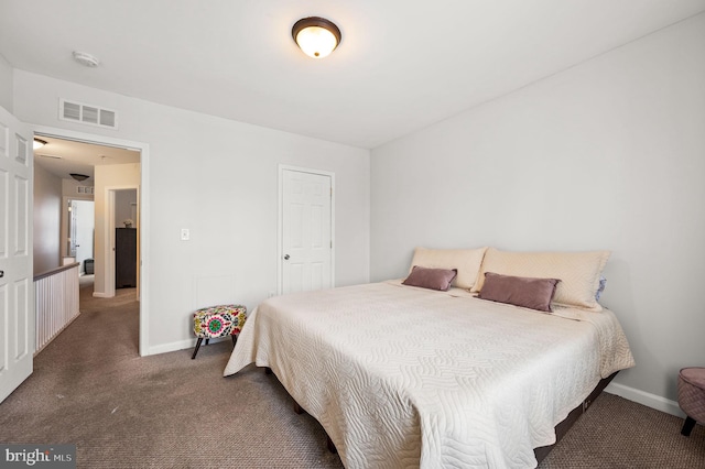 bedroom with dark carpet