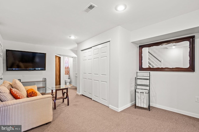 living room featuring light carpet