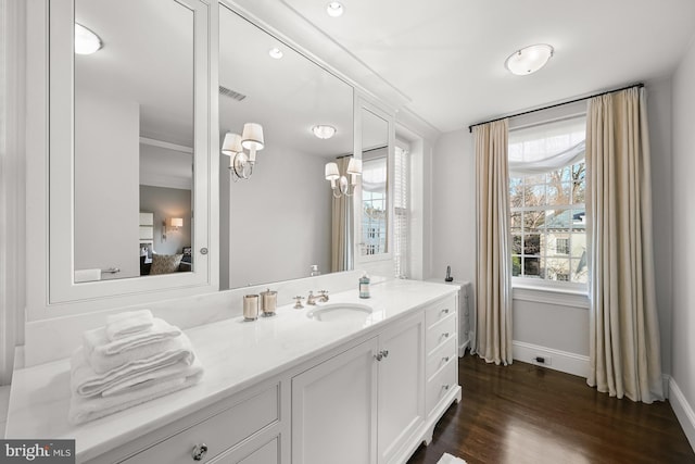 bathroom featuring vanity and wood-type flooring