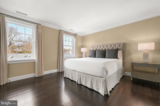 bedroom with dark wood-type flooring and ornamental molding