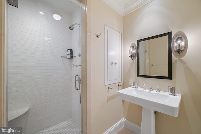 bathroom with an enclosed shower and ornamental molding