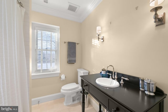 bathroom with toilet, vanity, tile patterned floors, and ornamental molding